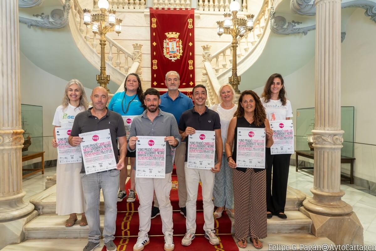 group of people presenting cabo de pop festival at the neoclassical-style hall of Cartagena City Council.