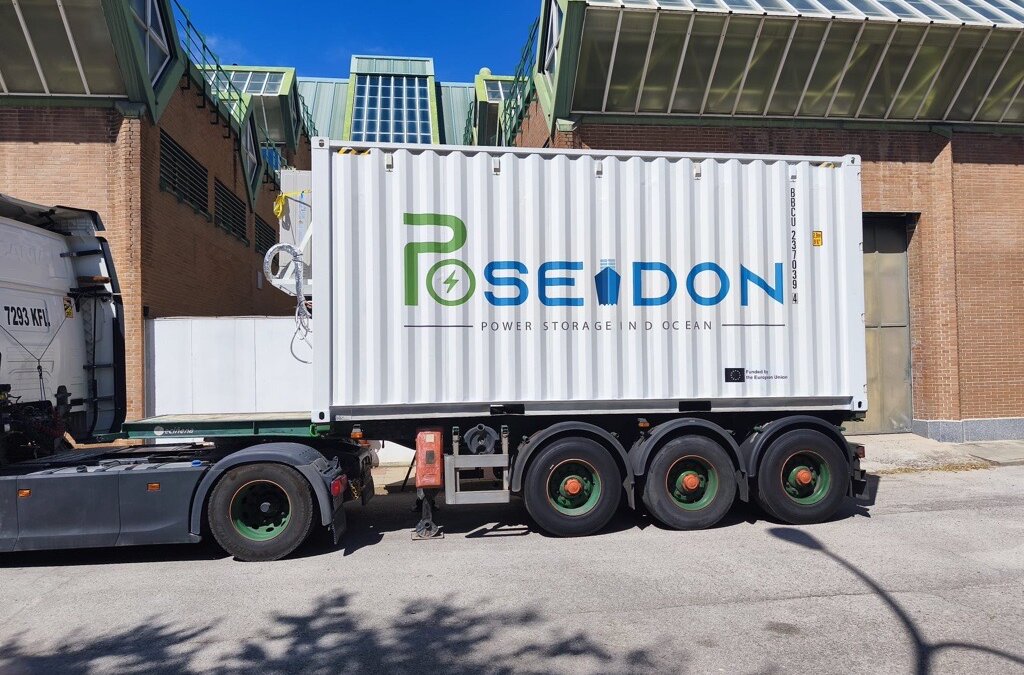 The image shows a white container on a truck and decorated with the logo of the European Comission and european-funded POSEIDON project.